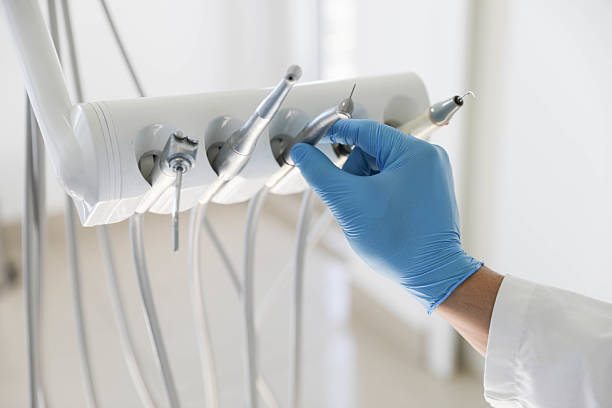 Professional Tooth Extraction technician working in Caro, MI